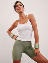 green high-waisted 5" inseam biker shorts  with pockets.